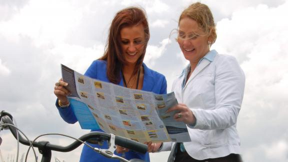 Women holding cycling map