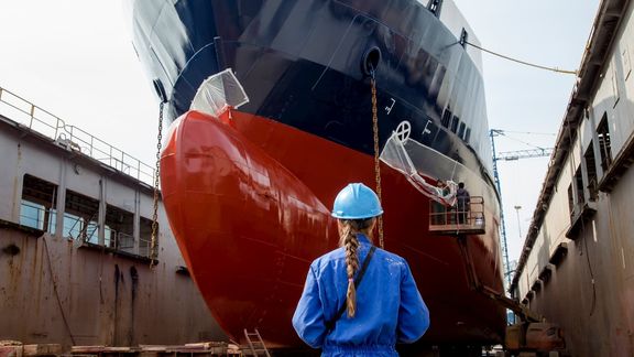 Ship in dock with lady