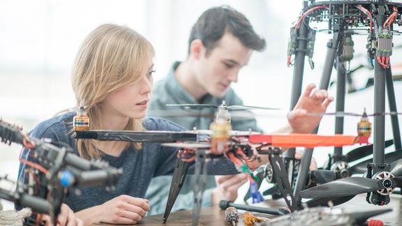 Students work on drones
