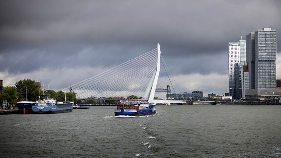 Inland barge with Erasmusbridge on the background