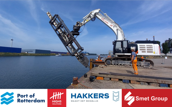 Excavator engaged in deepening and reinforcing quay walls with underwater anchors. With Port of Rotterdam, Hakkers and Smet Group logos