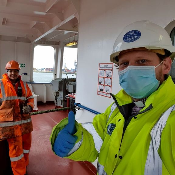 Chaplain to the Port of Rotterdam Dennis Woodward in PPE for working on board