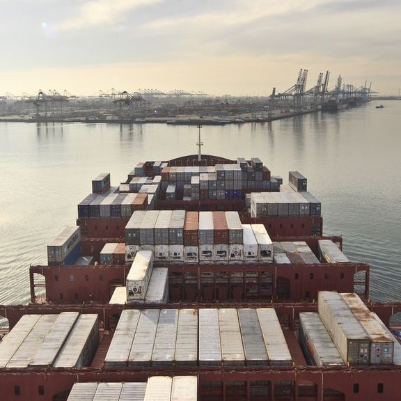 Container ship enters the harbour seen from the bridge