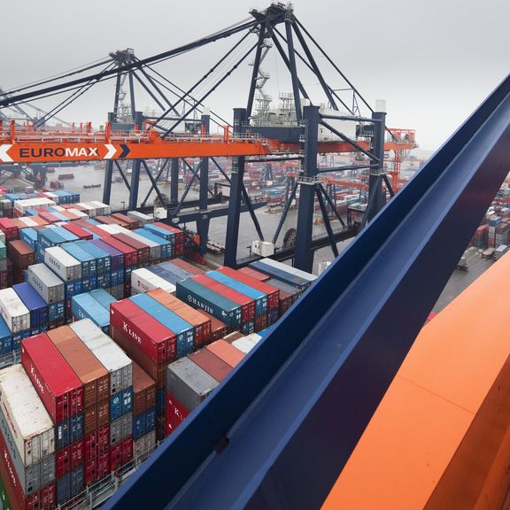 Container ship being unloaded