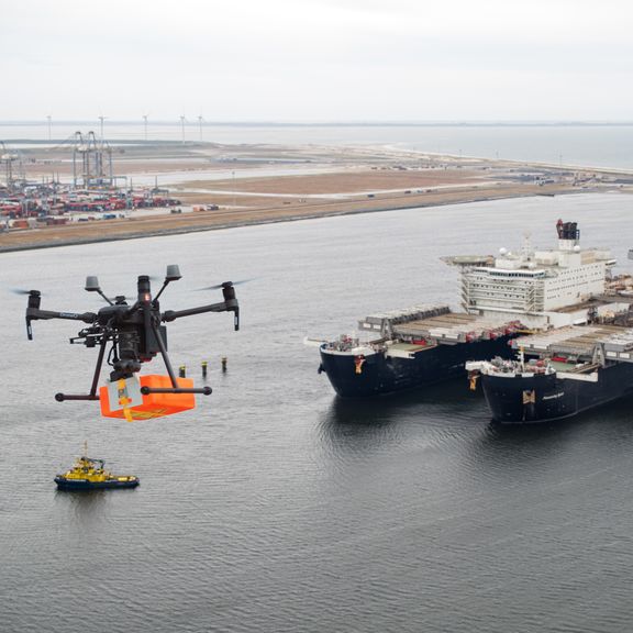 A drone flying towards the Pioneering Spirit