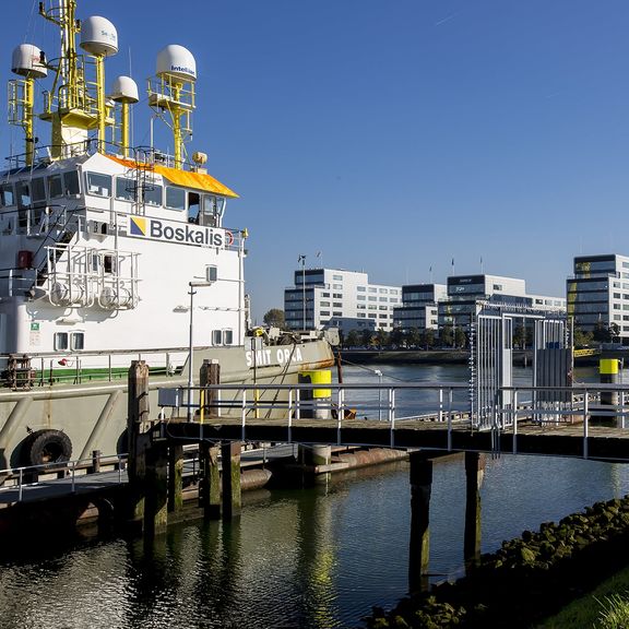 Moored Boskalis ship in the Waalhaven in front of the Boskalis offices