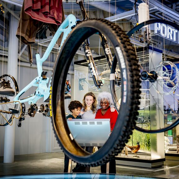 People looking at bike display in Portlantis